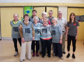 Group of 8 cage cricket players ver 50 years old with coaches Neil and Haidee