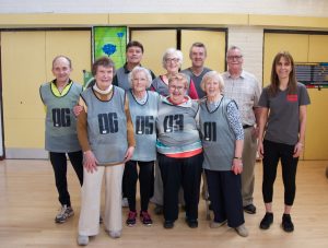 Group of 8 cage cricket players ver 50 years old with coaches Neil and Haidee